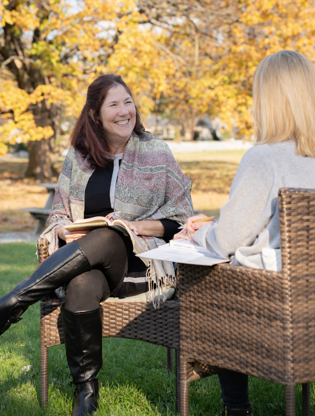Deborah sitting with a client in a coaching session